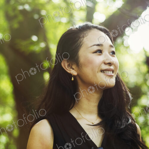 A young woman in woodland, outdoors. A young woman in woodland, outdoors.