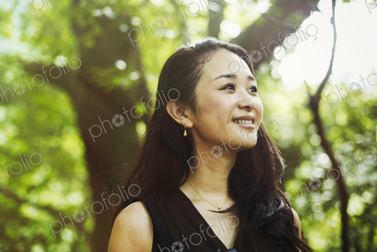 A young woman in woodland, outdoors.