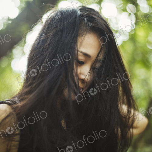 A young woman in woodland, outdoors. A young woman in woodland, outdoors.