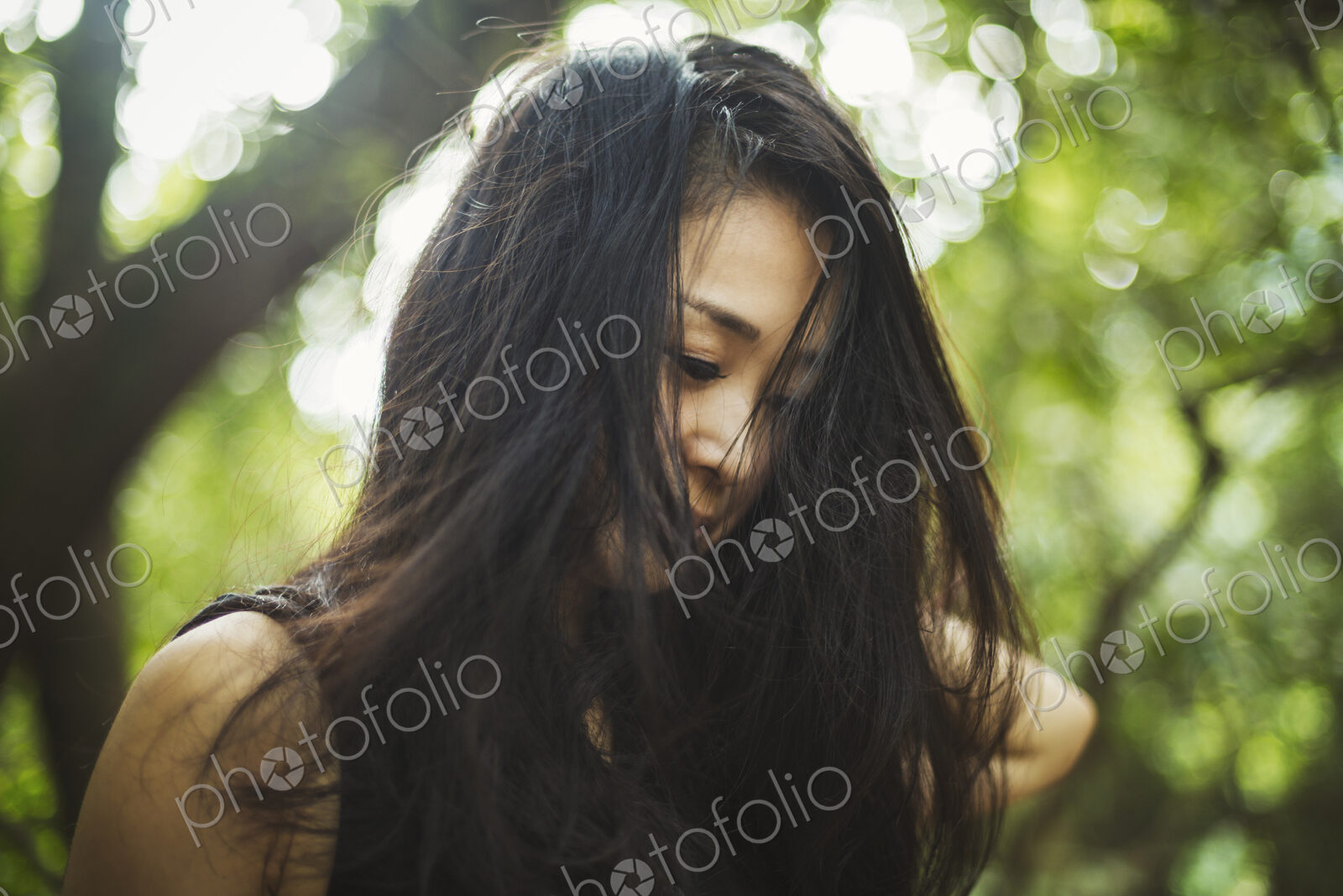 A young woman in woodland, outdoors.