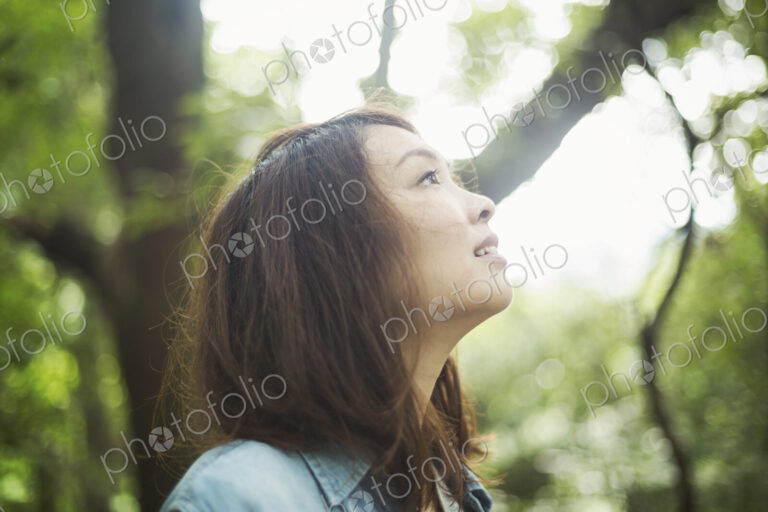 A young woman in woodland, outdoors.