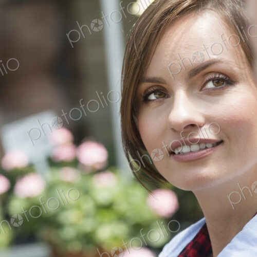 A young woman looking sideways at a companion. A young woman looking sideways at a companion.