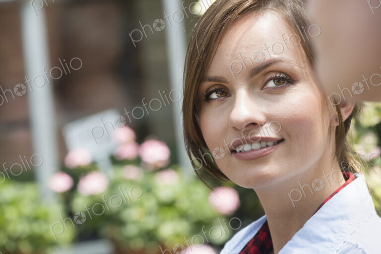 A young woman looking sideways at a companion.