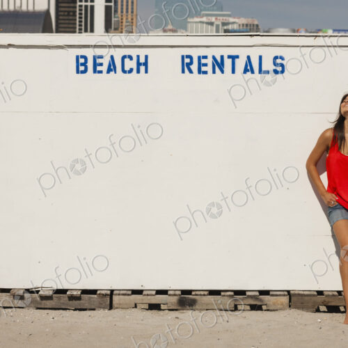 A young woman on the boardwalk at Atlantic City, in New Jersey, by the Beach Rentals… A young woman on the boardwalk at Atlantic City, in New Jersey, by the Beach Rentals…