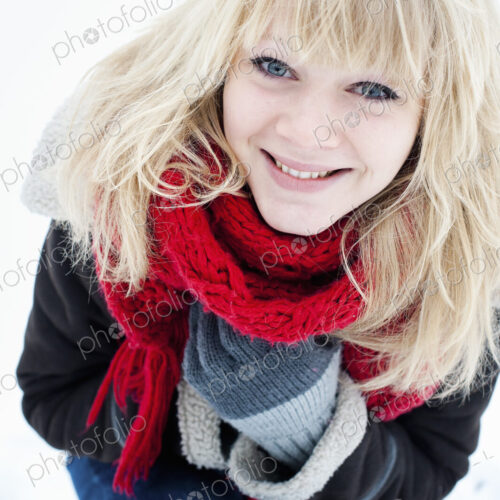 A young woman with blond hair in the snow. A young woman with blond hair in the snow.