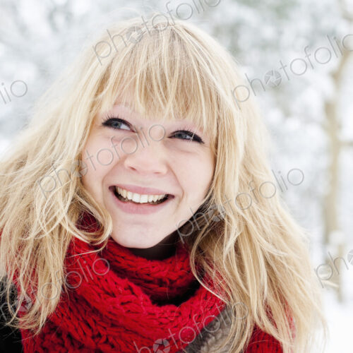 A young woman with blond hair in the snow. A young woman with blond hair in the snow.