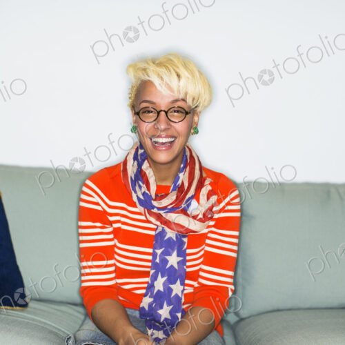 A young woman with blonde hair smiling at the camera.