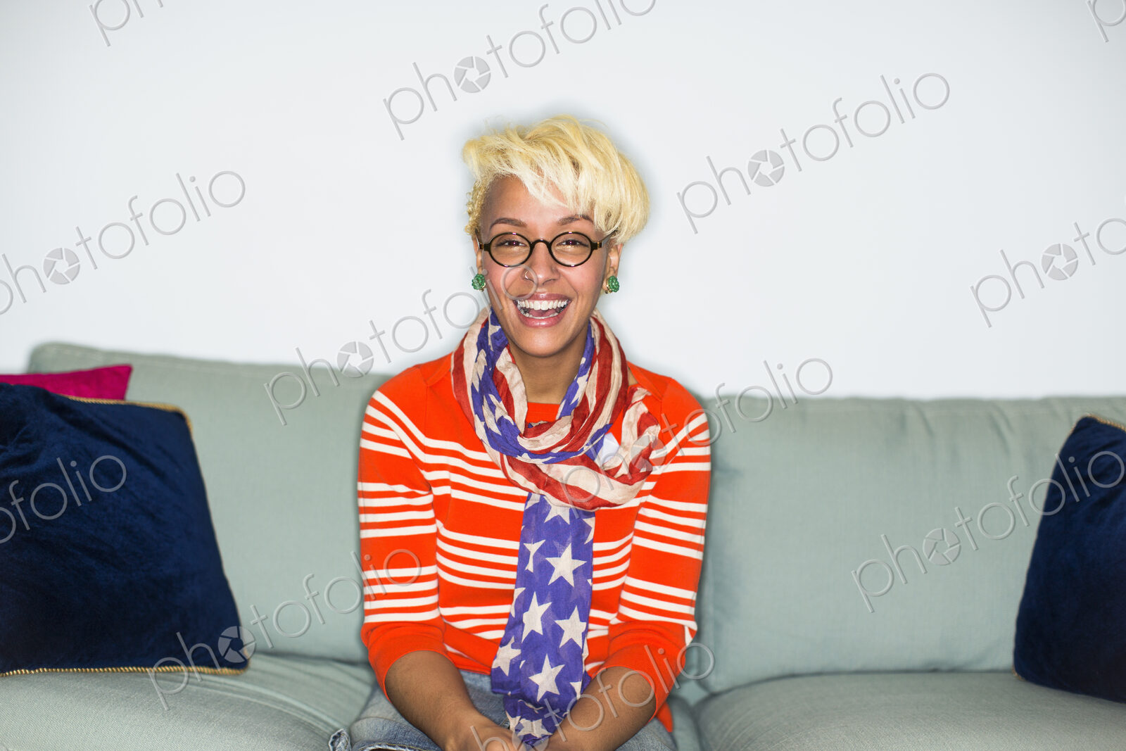 A young woman with blonde hair smiling at the camera.