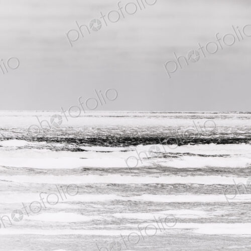 Abstract of breaking waves and moody sky at dusk Abstract of breaking waves and moody sky at dusk