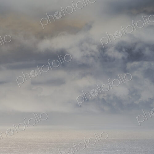Abstract of clearing storm over vast ocean at dusk, Oregon