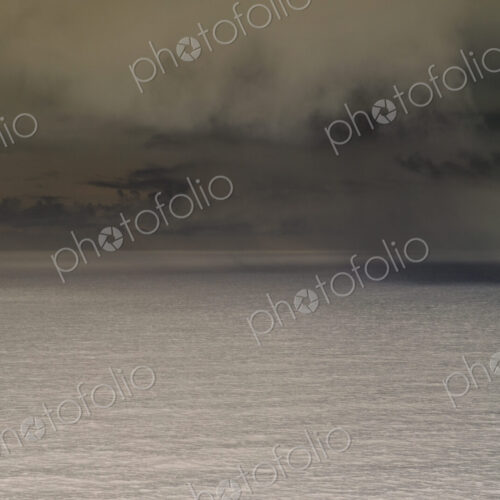 Abstract of clearing storm over vast ocean at dusk, Oregon