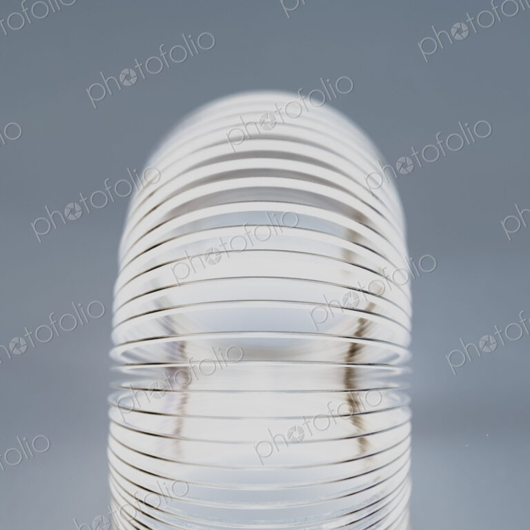 Abstract of metal coiled slinky, length of fine wire wound around and stretched, black…