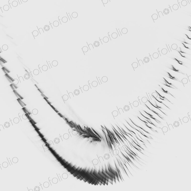 Abstract of metal coiled slinky, length of fine wire wound around and stretched, black…