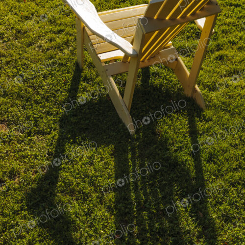 Adrinonak chair in sunlight on lawn, WA, USA