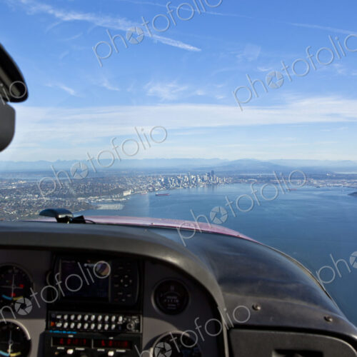 Aerial View Of City On Coast Of Lake