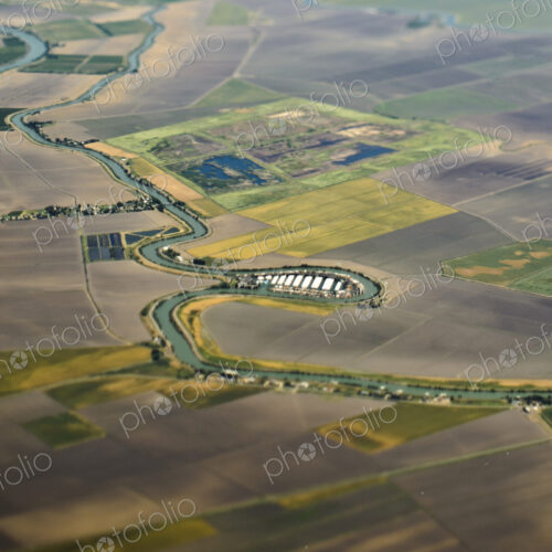 Aerial View of a River Passing Through Farmland Aerial View of a River Passing Through Farmland