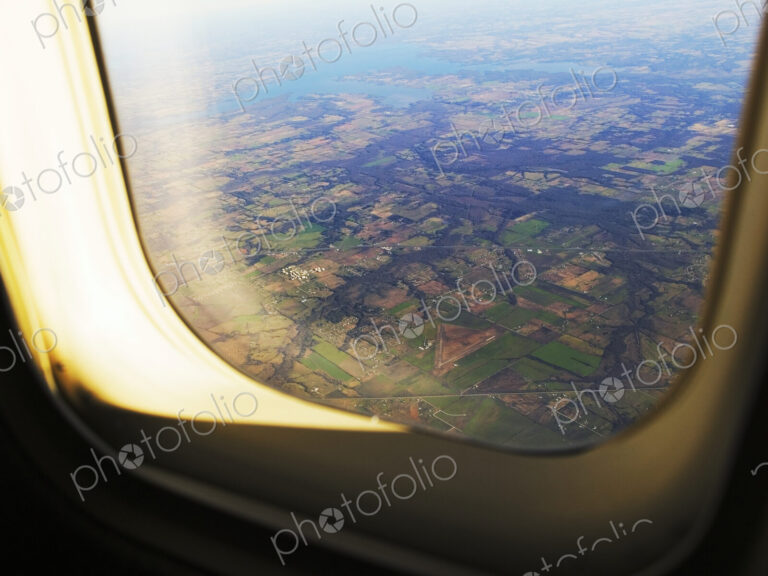 Aerial of Farmland Through Airplane Window