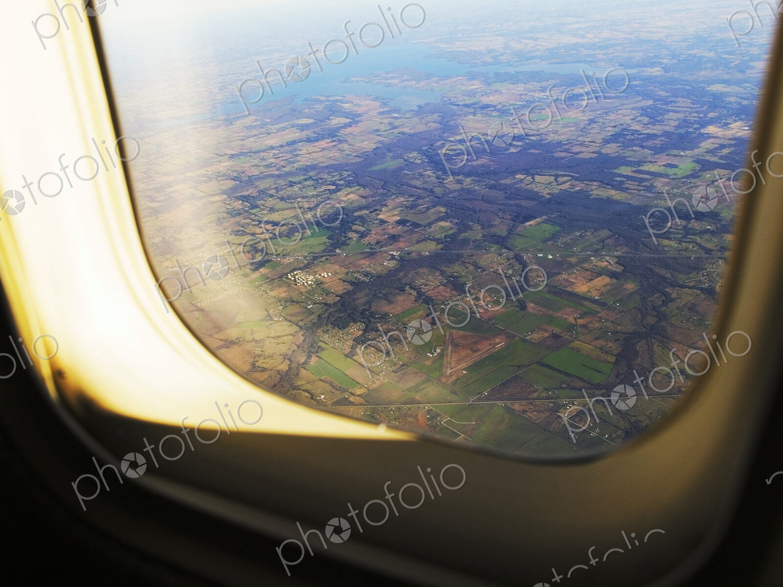 Aerial of Farmland Through Airplane Window
