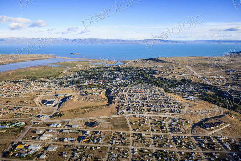 Aerial view of El Calafate, a sprawing town on the coast, a sea channel, on the edge…