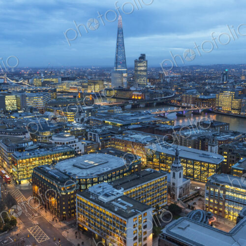Aerial view of London, UK in the evening, with river Thames and the Shard in the distance.