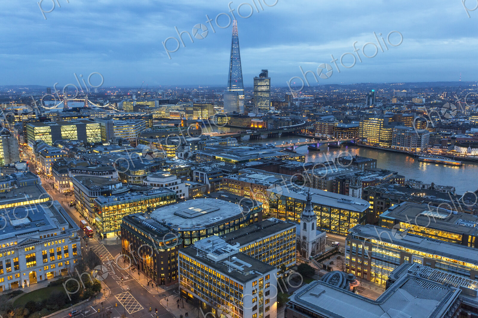 Aerial view of London, UK in the evening, with river Thames and the Shard in the distance.