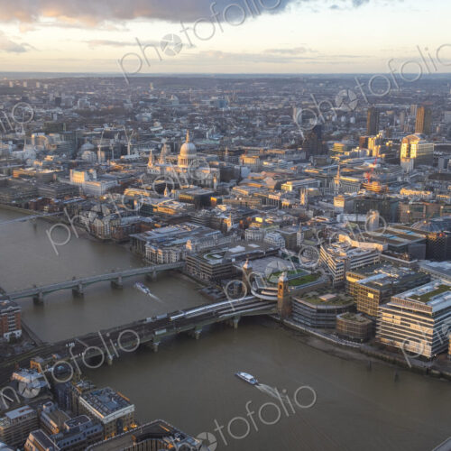 Aerial view of London with bridges crossing river Thames.