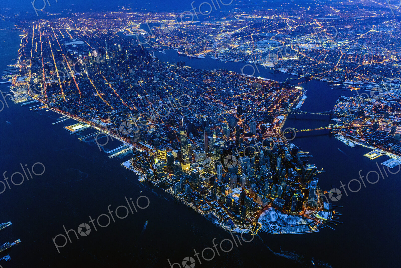 Aerial view of Manhattan cityscape and river at night, New York, United States