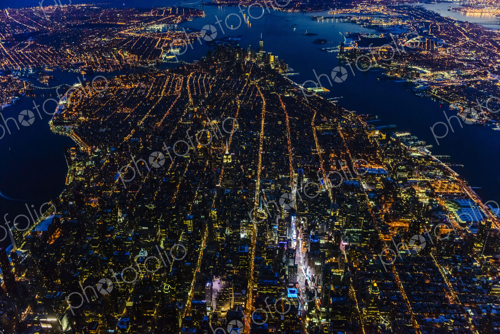 Aerial view of Manhattan cityscape and river at night, New York, United States