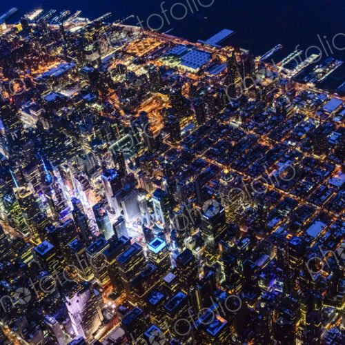 Aerial view of Manhattan cityscape at night, New York, United States Aerial view of Manhattan cityscape at night, New York, United States