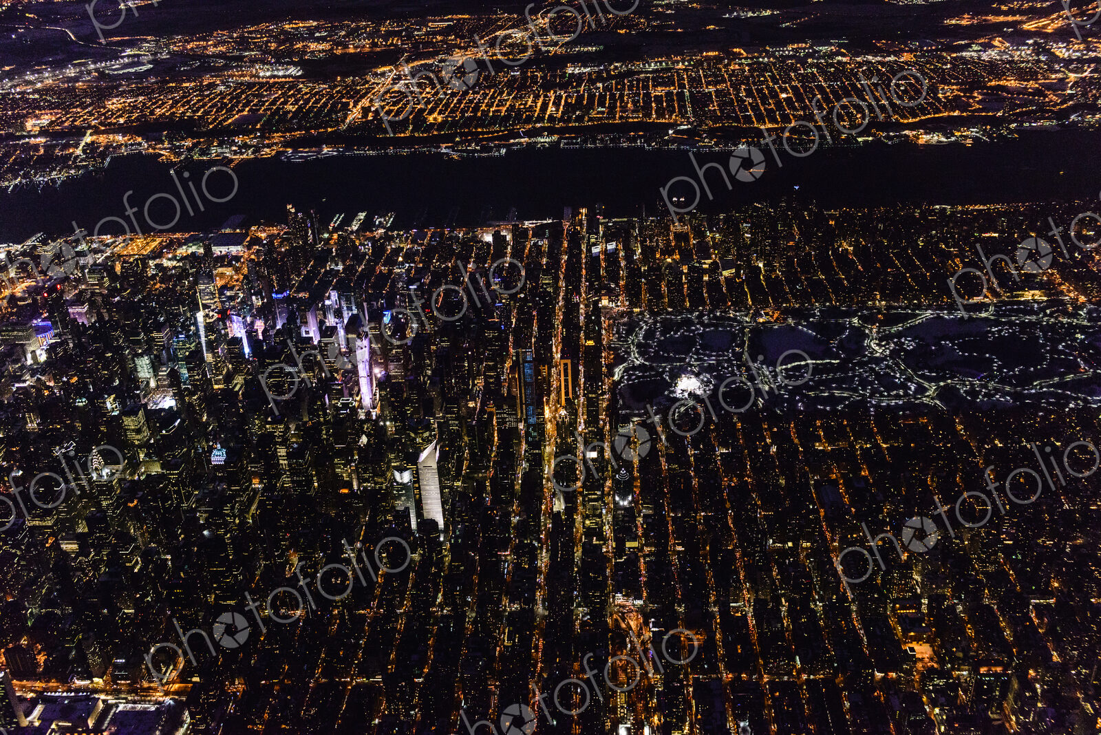 Aerial view of Manhattan cityscape at night, New York, United States