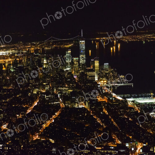 Aerial view of Manhattan cityscape at night, New York, United States Aerial view of Manhattan cityscape at night, New York, United States