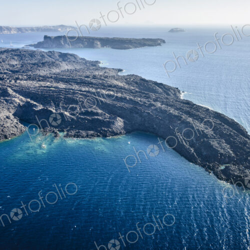 Aerial view of a headland on a island in the Aegean sea, volcanic rock formations,… Aerial view of a headland on a island in the Aegean sea, volcanic rock formations,…