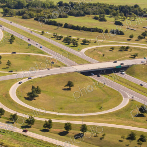 Aerial view of a large highway turnoff, intersection, with exit roads in circles. Aerial view of a large highway turnoff, intersection, with exit roads in circles.
