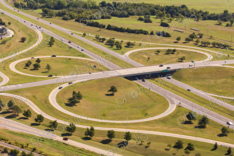 Aerial view of a large highway turnoff, intersection, with exit roads in circles.