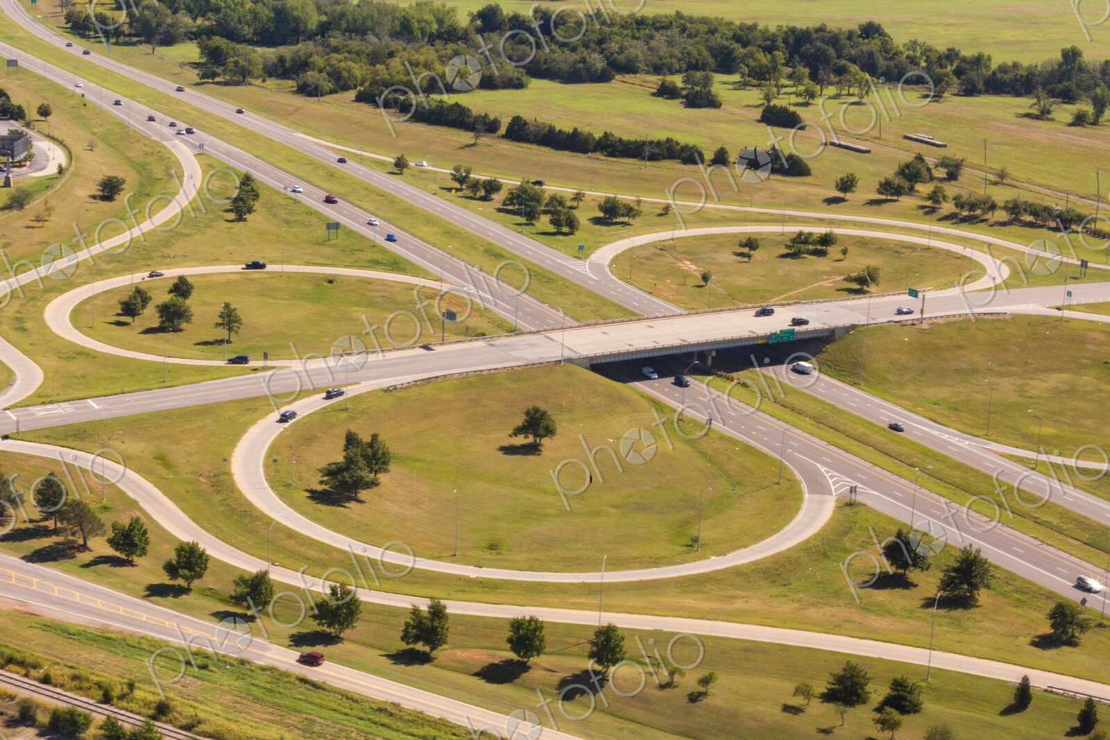 Aerial view of a large highway turnoff, intersection, with exit roads in circles.