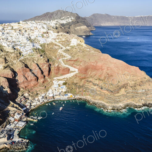 Aerial view of an island in the deep blue seas of the Aegean sea, rock formations,…