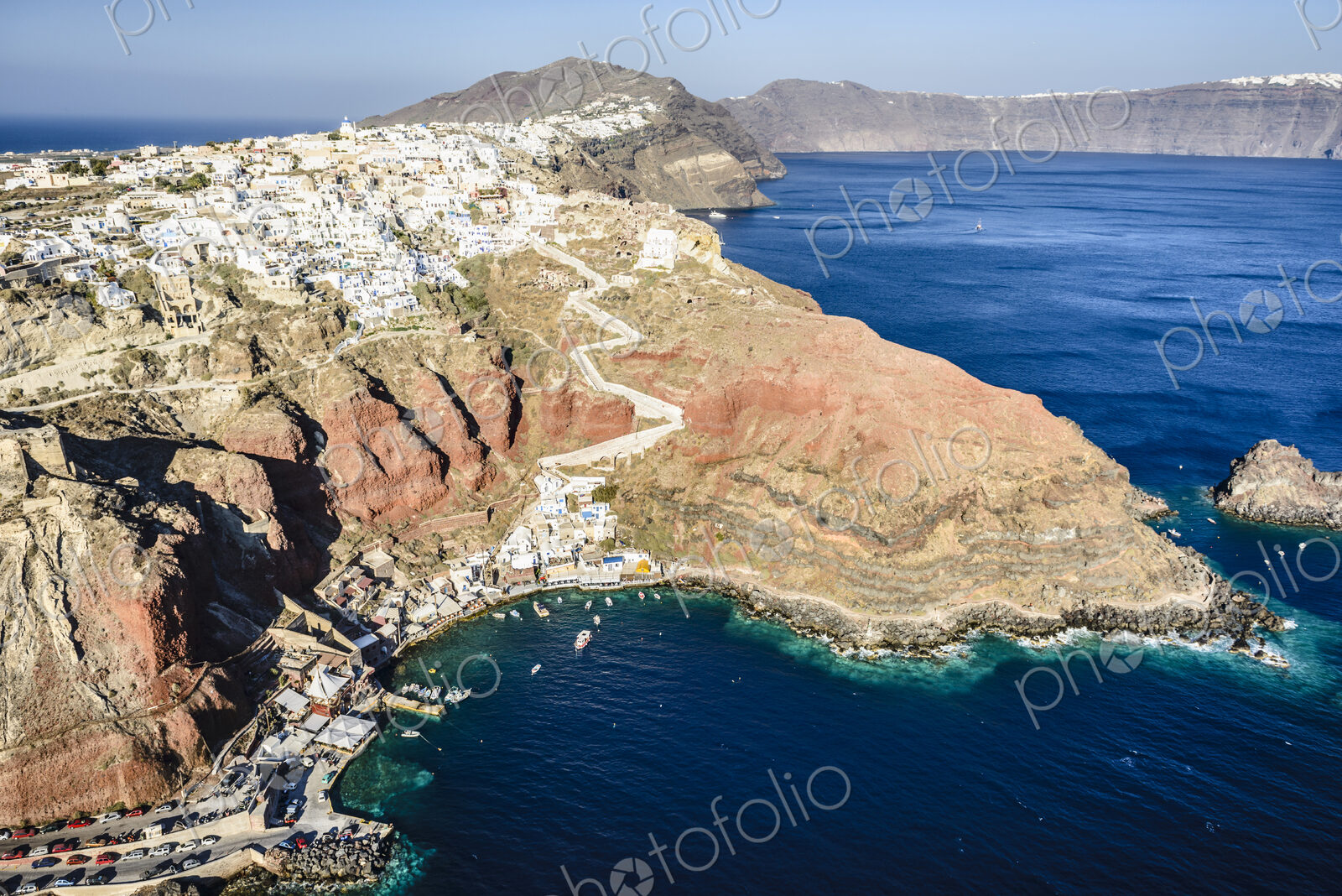Aerial view of an island in the deep blue seas of the Aegean sea, rock formations,…