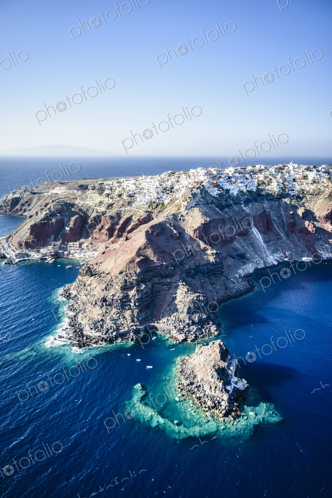 Aerial view of an island in the deep blue seas of the Aegean sea, rock formations,…