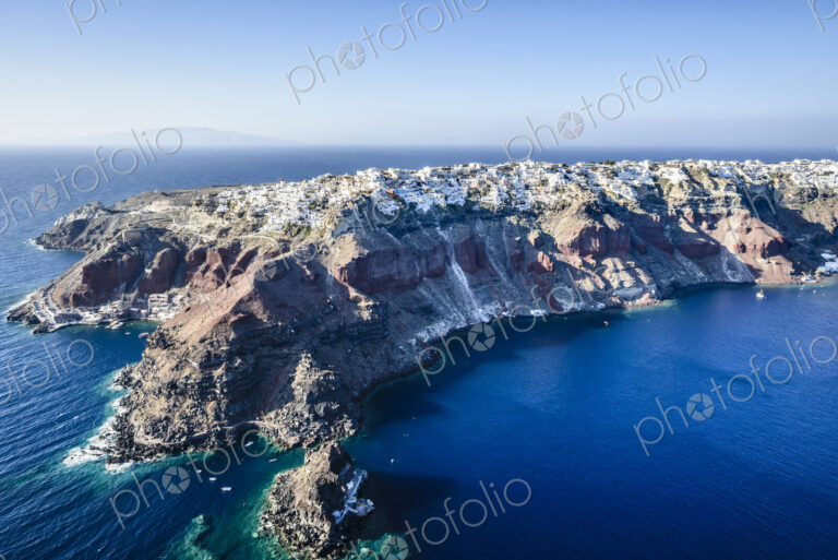 Aerial view of an island in the deep blue seas of the Aegean sea, rock formations,…
