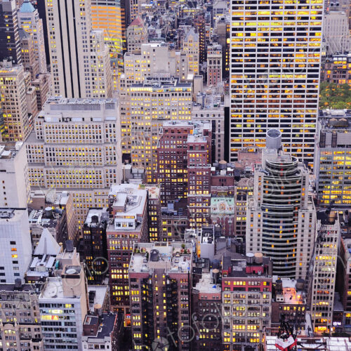 Aerial view of highrise buildings in cityscape at twilight Aerial view of highrise buildings in cityscape at twilight