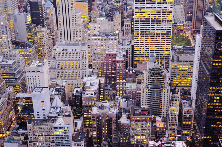 Aerial view of highrise buildings in cityscape at twilight