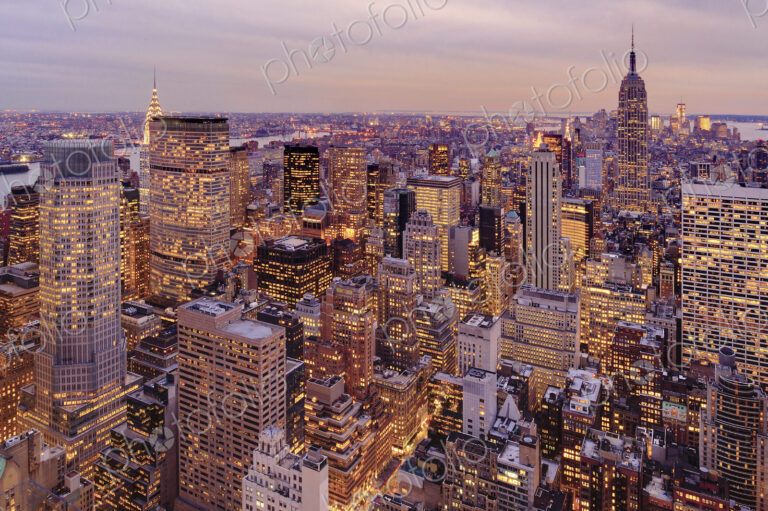 Aerial view of highrise buildings in cityscape at twilight