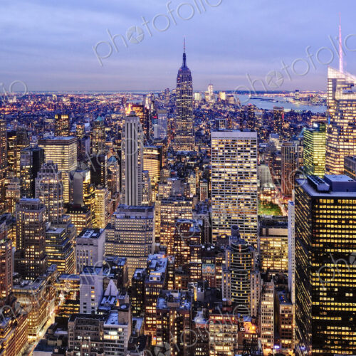 Aerial view of highrise buildings in cityscape at twilight Aerial view of highrise buildings in cityscape at twilight