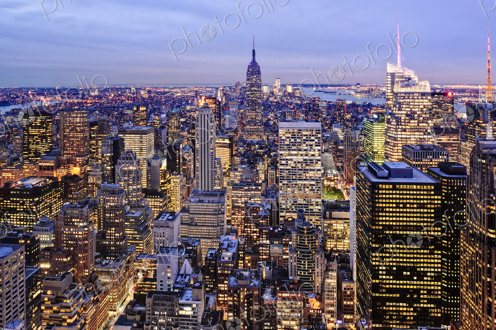 Aerial view of highrise buildings in cityscape at twilight