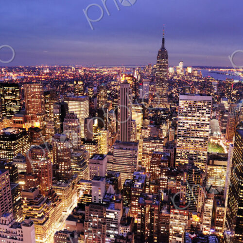 Aerial view of highrise buildings in cityscape at twilight Aerial view of highrise buildings in cityscape at twilight