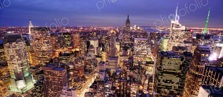 Aerial view of highrise buildings in cityscape at twilight