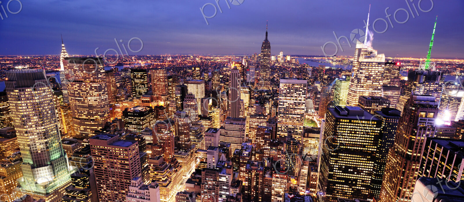 Aerial view of highrise buildings in cityscape at twilight
