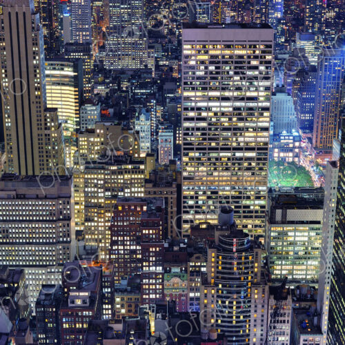 Aerial view of highrise buildings in cityscape at twilight Aerial view of highrise buildings in cityscape at twilight