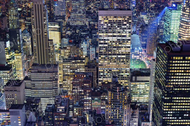 Aerial view of highrise buildings in cityscape at twilight