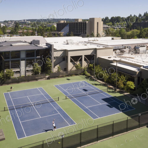 Aerial view of tennis court and people playing tennis. Aerial view of tennis court and people playing tennis.